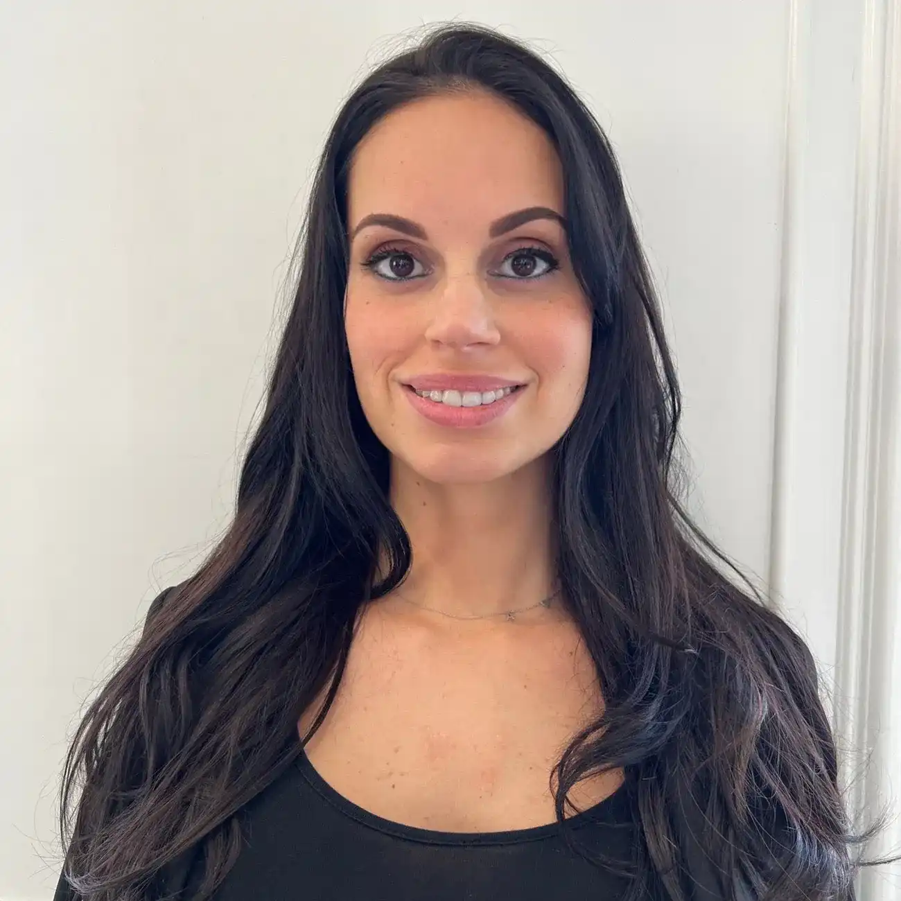 Portrait of Nicole, a professional stylist at Panico Salon & Spa, showcasing their expertise and style.