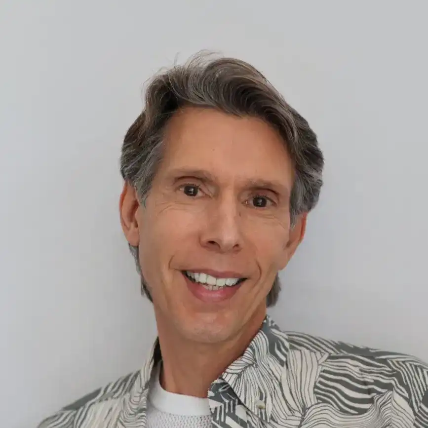 Portrait of Angelo, a professional stylist at Panico Salon & Spa, showcasing their expertise and style.