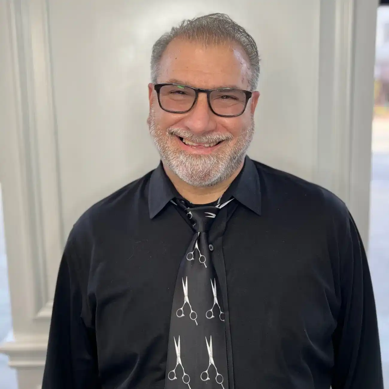 Portrait of Peter, a professional stylist at Panico Salon & Spa, showcasing their expertise and style.